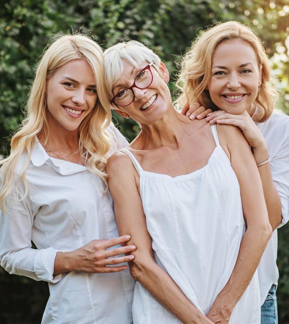 generation of three woman smiling together